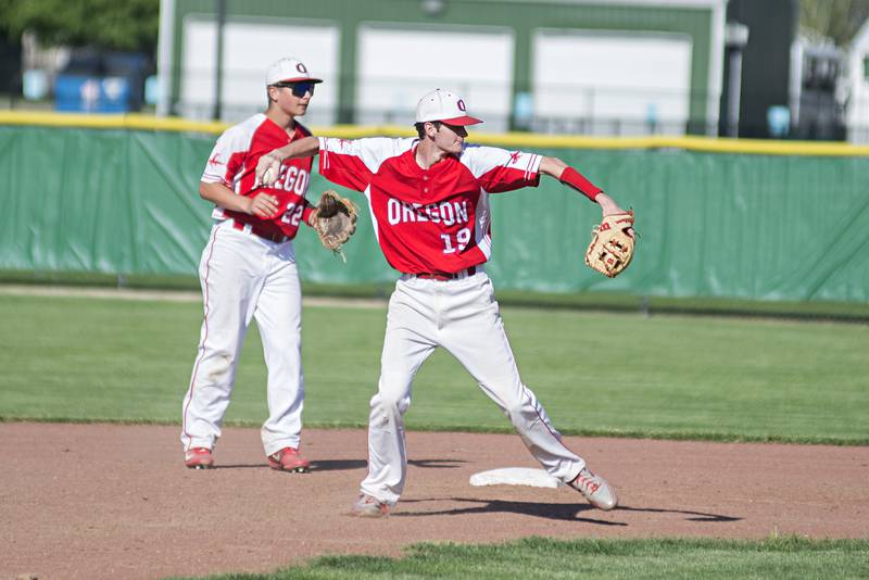Oregon’s Miley Smith throws to first for an out Monday, May 16, 2022 against Rock Falls in the IHSA baseball quarterfinals.