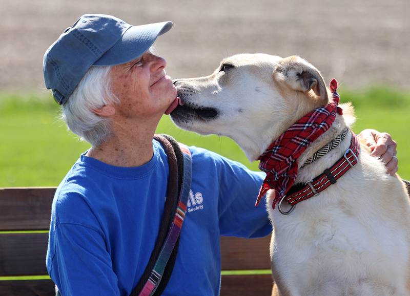 Longtime Tails Humane Society volunteer Nancy Rigler spends some time with Butterscotch Thursday, April 23, 2026, at Tails in DeKalb.