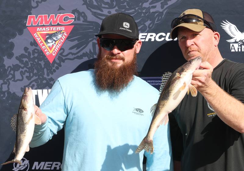 Kevin Loebach of Lostant and Turner Jamison of Princeton, pose with their fish that they caught during the annual Masters Walleye Circuit tournament on Friday, March 20, 2026 at the Spring Valley Boat Club.