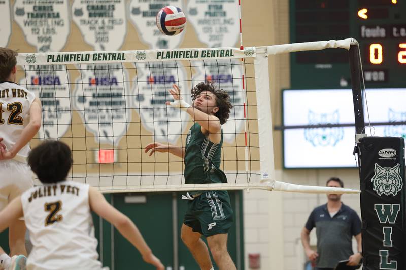 Plainfield Central’s Draedyn Sanford pushes over a shot against Joliet West on Tuesday, April 23, 2024 in Plainfield.