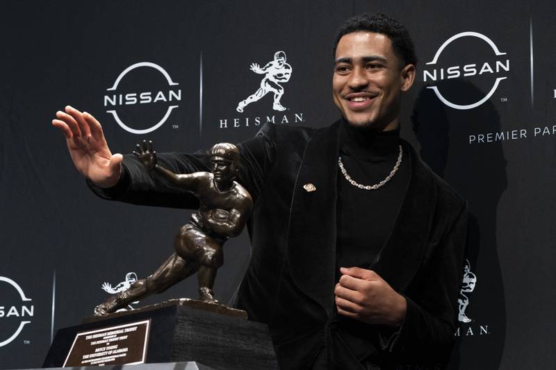 FILE - Alabama quarterback Bryce Young poses for a photograph after winning the Heisman Trophy, Saturday, Dec. 11, 2021, in New York. Young is again a top contender for the 2022 Heisman Trophy. (AP Photo/John Minchillo, File)