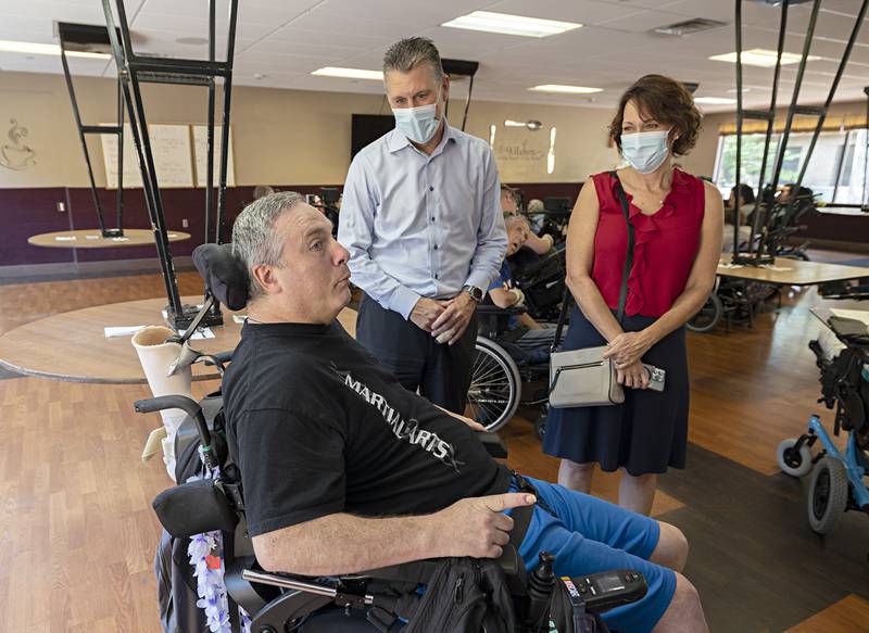 Winning Wheels resident Jeff Fuhs meets State Senator Win Stoller and wife Amy during a tour of the Prophetstown facility Tuesday, July 25, 2023.