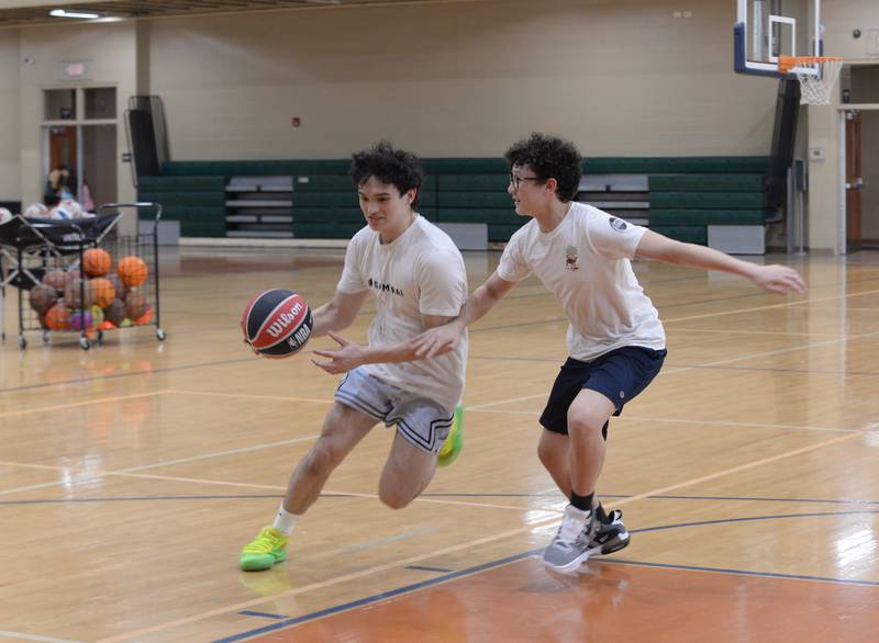 (left) Ethan and Elijah Kimmerly of Lombard play basketball during the Glen Ellyn Park District unplug from technology event held Saturday July 13, 2024.