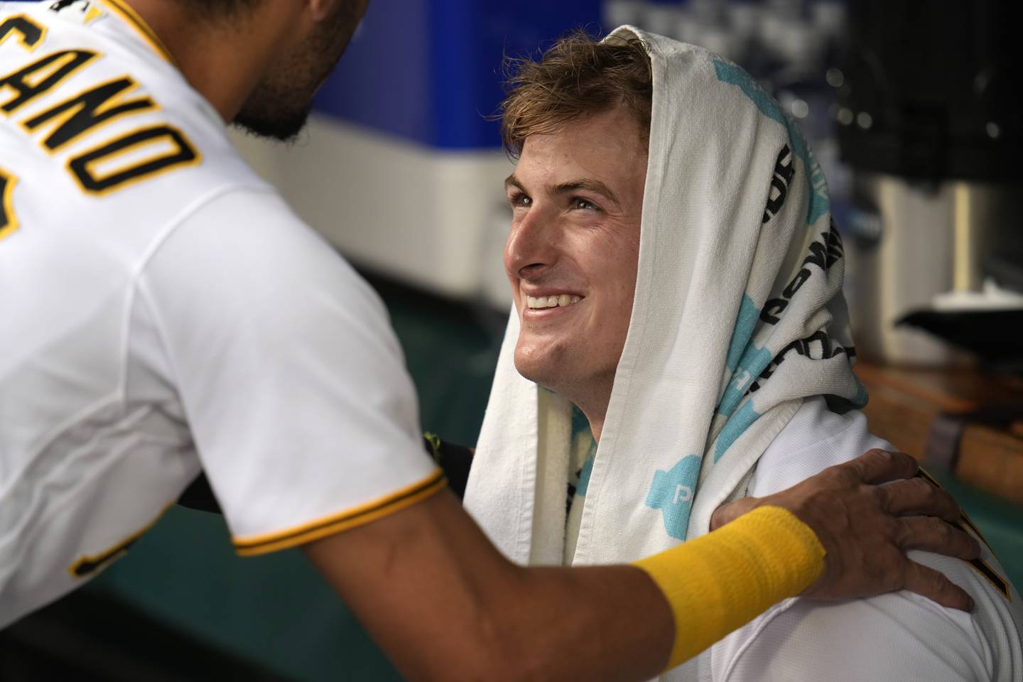 Pittsburgh Pirates starting pitcher Quinn Priester interacts in the dugout with Tucupita Marcano before taking the field for his major league debut, Monday, July 17, 2023, against the Cleveland Guardians in Pittsburgh.