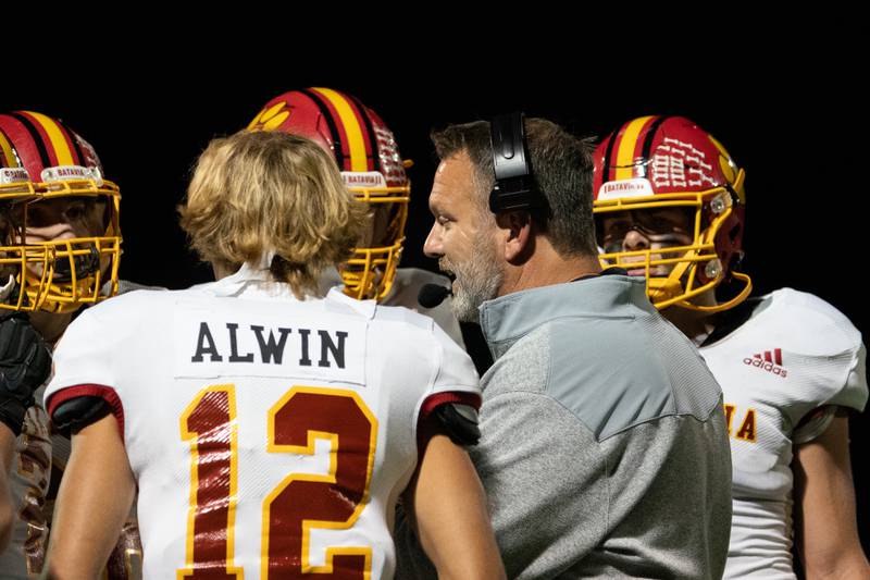 Batavia’s head coach Dennis Piron talks to his players during a break in play against Glenbard North during a football game at Glenbard North High School in Carol Stream on Friday, Sep 23, 2022.