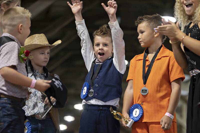 Little Mister Ogle County contestant Jaxson King celebrates winning the title Thursday, July 30, 2025, at the Ogle County Fairgrounds.