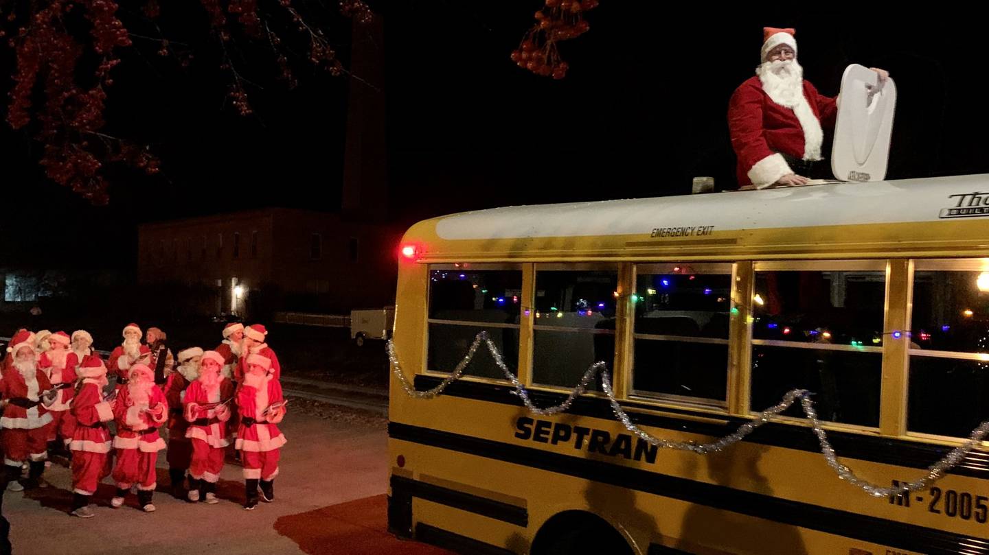 Santa Claus (atop school bus) leads the Santa Dancers through the Yorkville Holiday Parade on Friday Nov. 17, 2023.