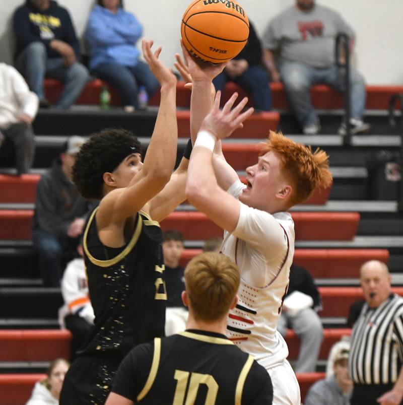 Forreston's Connor Politsch draws contact as he drives to the basket against Pecatonica in a NUIC matchup at Forreston High School on Wednesday, Feb. 11, 2026.