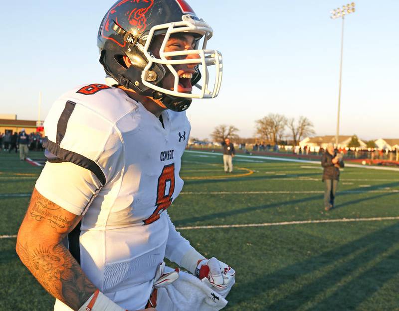 Oswego's Conor Morton celebrates the Panthers' 17-14 win over Huntley on Saturday in Class 8A second round playoff action.