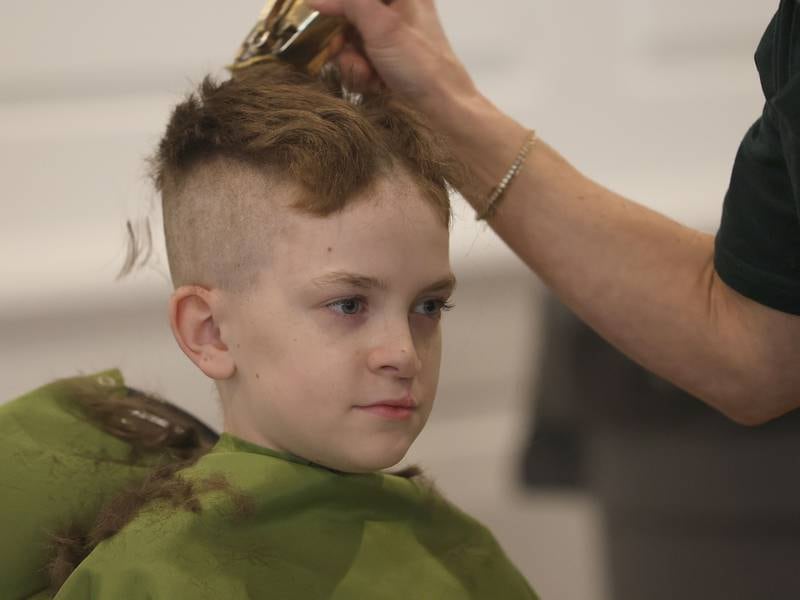 Hair falls off of the back of Jake Brown's head during the 19th annual Illinois Valley Emergency Services Annual St. Baldrick's Event on Sunday, March 22, 2026 at Senica's Oak Ridge in La Salle