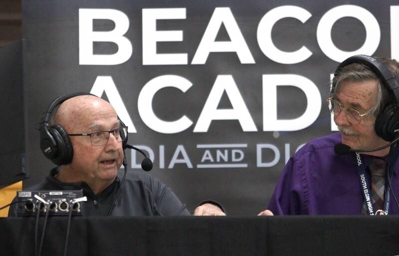 Jim Hinkle, left, calls the Crystal Lake South vs. Lake Zurich semifinal game in Hinkle Holiday Classic boys basketball tournament game action at Jacobs High School Wednesday.