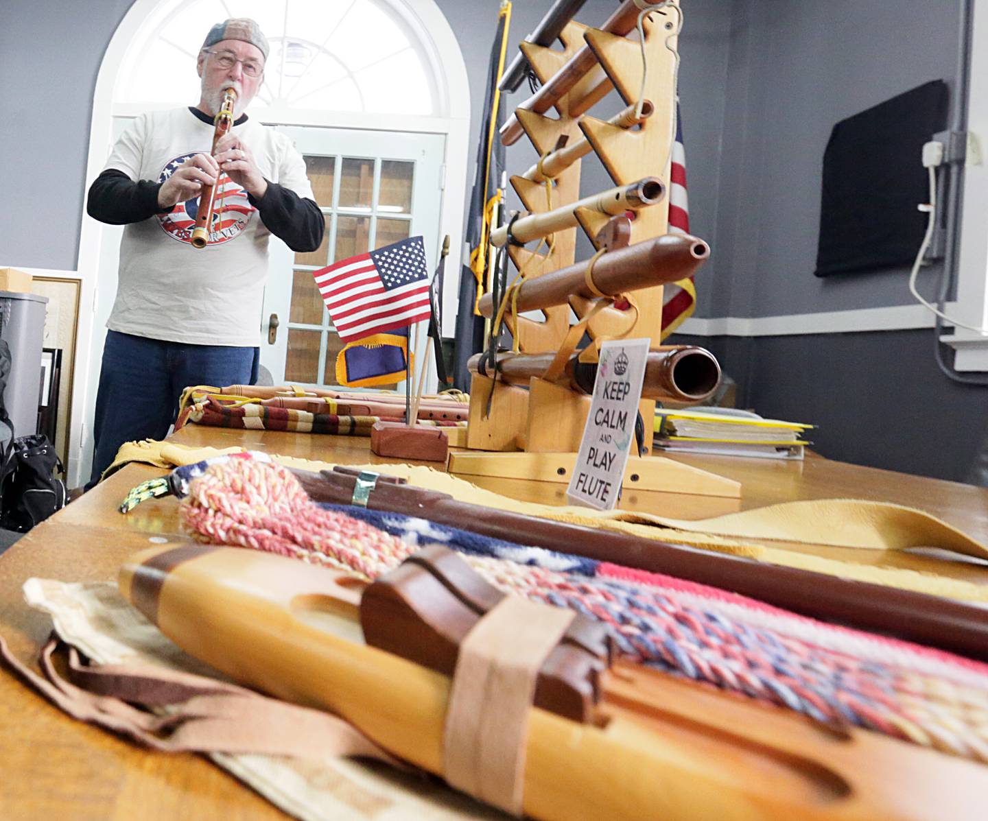 Ken Troyan, founder of "Flutes for Vets" plays one of his flutes at the American Legion post 33 in Ottawa on Thursday Jan. 6, 2022. Troyan, starved the program last year for something to give back to veterans. The program provides each veteran with a free beginner flute to practice on. Veterans interested in the program can email Troyan at kennethroyan@gmail.com