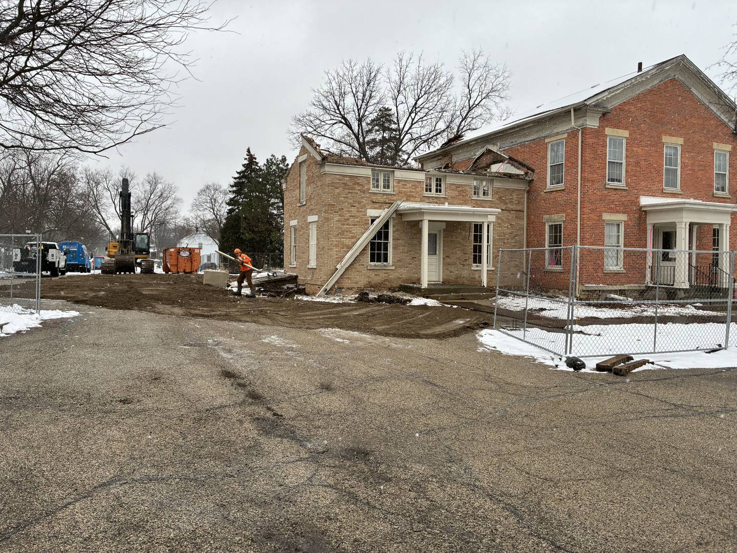 Demolition work begins is underway on Dec. 31, 2025, at the Academy Building in Crystal Lake, built in the 1850s. Hopes of moving the structure off the property of the church that owns in were dashed when it was deemed unfeasible.