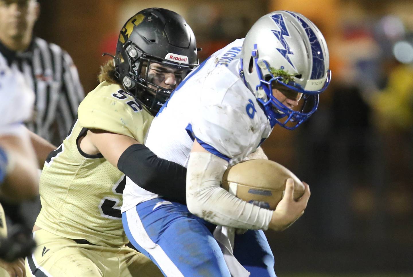 Sycamore linebacker Jackson Funderburg brings down Woodstock quarterback Liam Mickle during their game Friday, Oct. 15, 2021, at Sycamore High School.