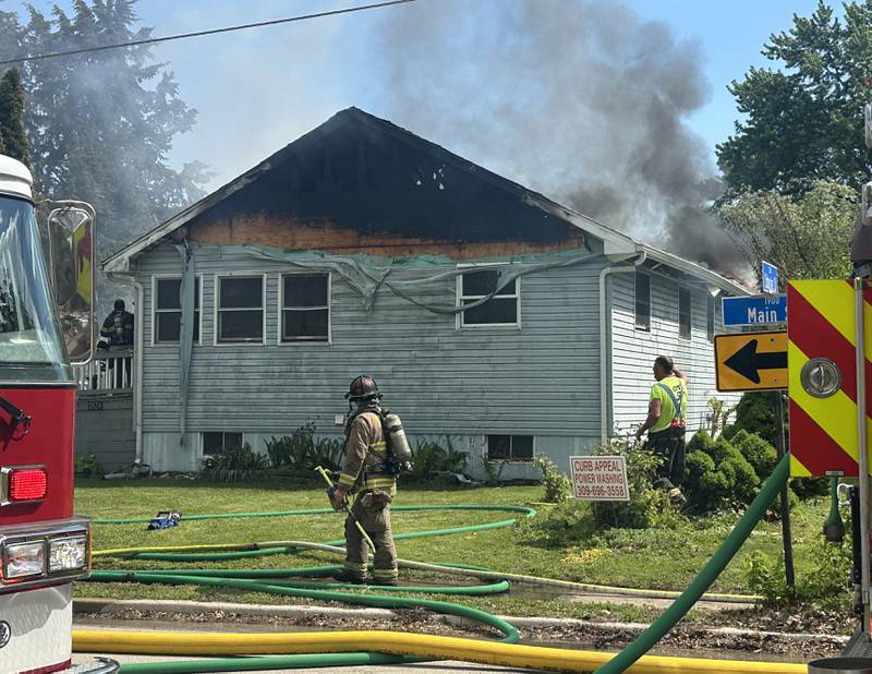 Firefighters work the scene of a structure fire in the 1900 block of Main Street on Monday, May 4, 2026 in Peru.