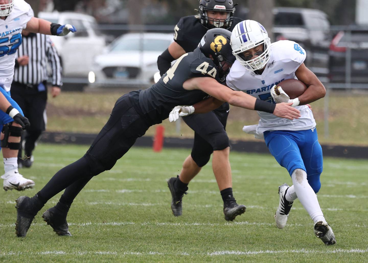 St. Francis' Jalen Carter is tackled by Sycamore's Cooper Bode Saturday, Nov. 16, 2024, during their Class 5A quarterfinal game at Sycamore High School.
