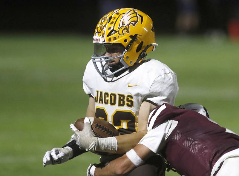 Jacobs' Cooper Gulgren is tackled by Prairie Ridge's Logan Thennes during a Fox Valley Conference football game on Friday, Sept. 5, 2025, at Prairie Ridge High School in Crystal Lake.