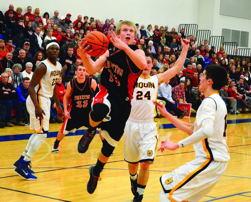 Forreston's Robert DeVries goes up for a layup as he carved his way through the Aquin defense Friday night. DeVries finished with 33 points to help his team win 59-58 at the Eastland Sectional. Photo by Chris Johnson