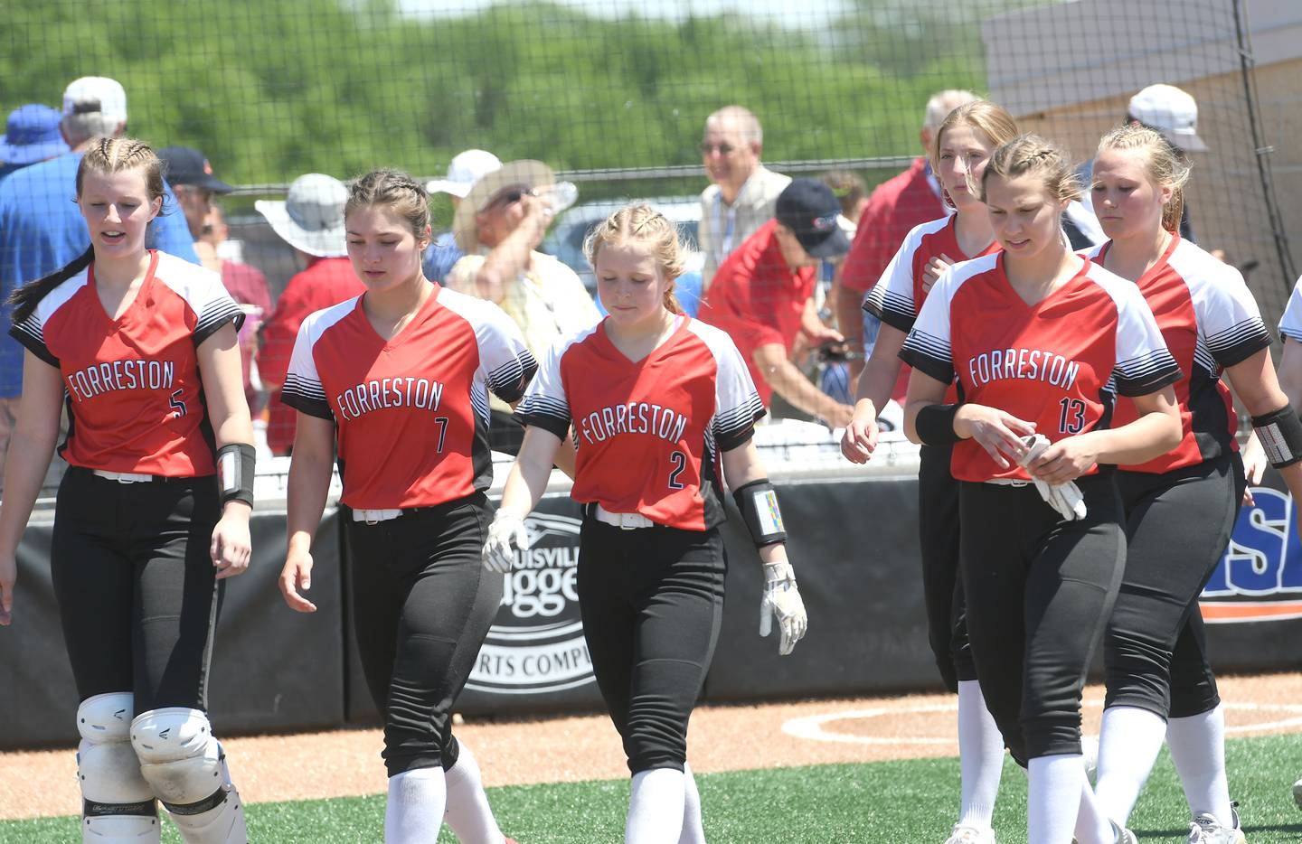Forreston's Hailey Greenfield, Brooke Boettner, Alaina Miller, Jenna Greenfield, Kara Erdmann, and Aubrey Sanders walk off the field toward their dugout after falling to Casey-Westfield 4-0 in semifinal action at the 1A softball finals in Peoria on Friday, June 3.