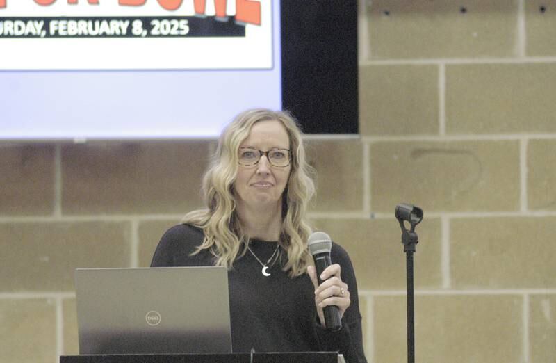 Moderator Jen Kuehl reads questions at the Stupor Bowl. The event was held Saturday, Feb. 8, at Reagan Middle School in Dixon.