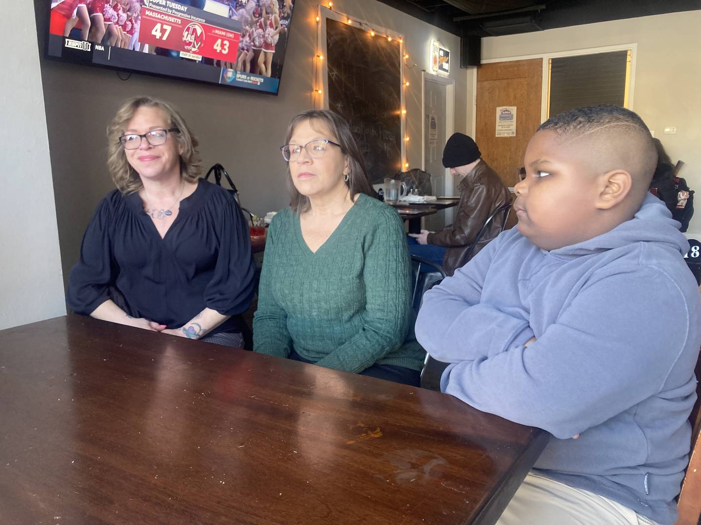 Melissa Robertson sits with her aunt Jeanne Beyer and her son Amar at Richardson's Downtown Sports Bar and Grill in downtown Joliet after the sentencing of John Shadbar. 
Wednesday, Jan. 28, 2026.