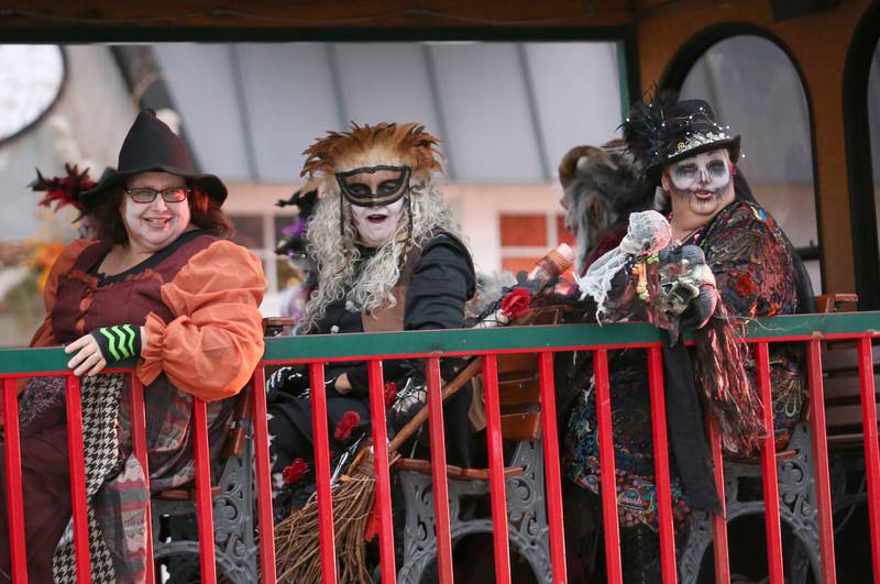 The Hocus Pocus Hags ride on a trolley in the 5th annual Halloween Parade on Saturday, Oct. 28, 2023 downtown Princeton.