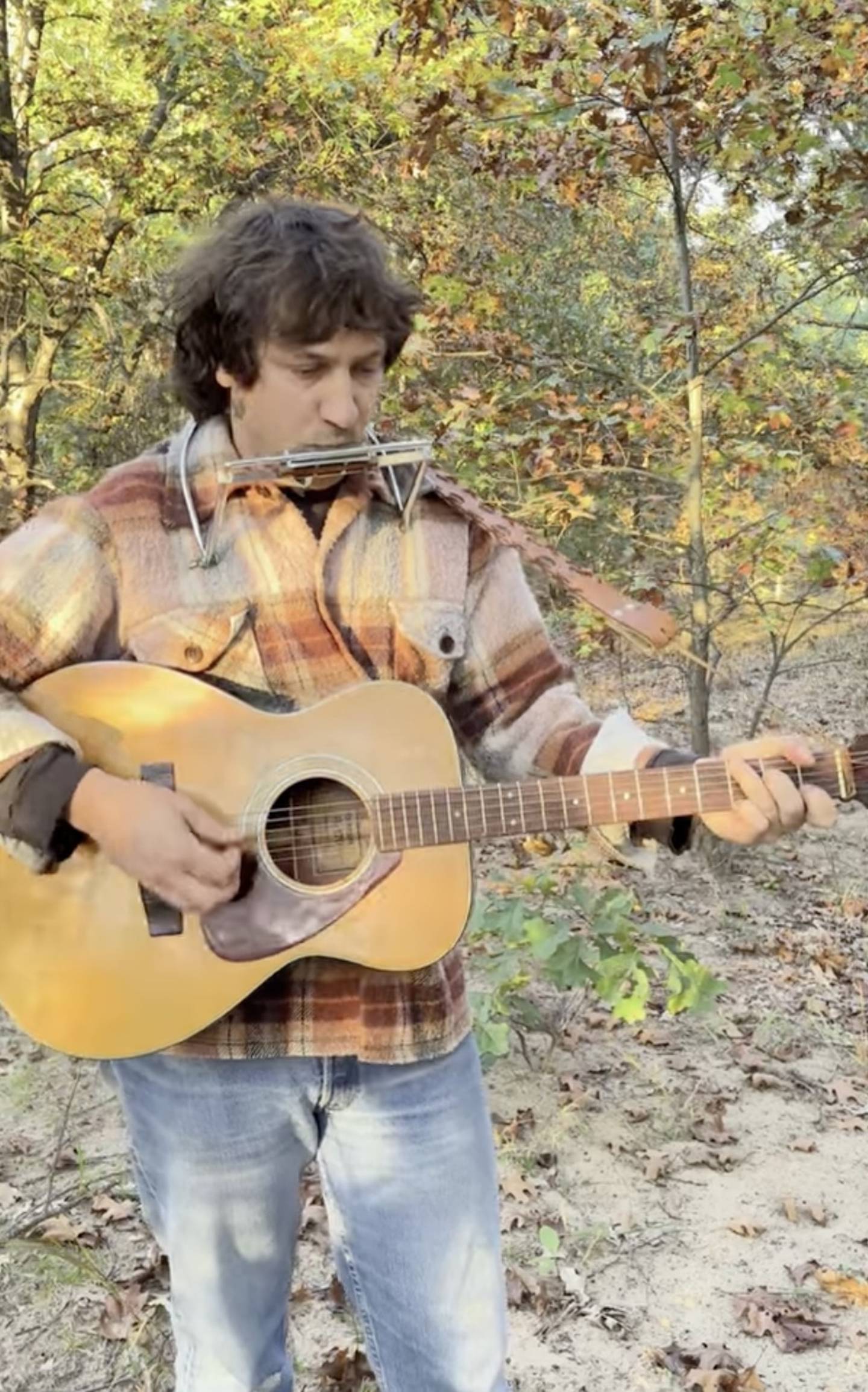 Crystal Lake native Cass Cwik, seen here in a screenshot from YouTube, wrote a folk ballad in honor of the McHenry snowy owl that arrived in the area a year ago but was later killed by a car strike.