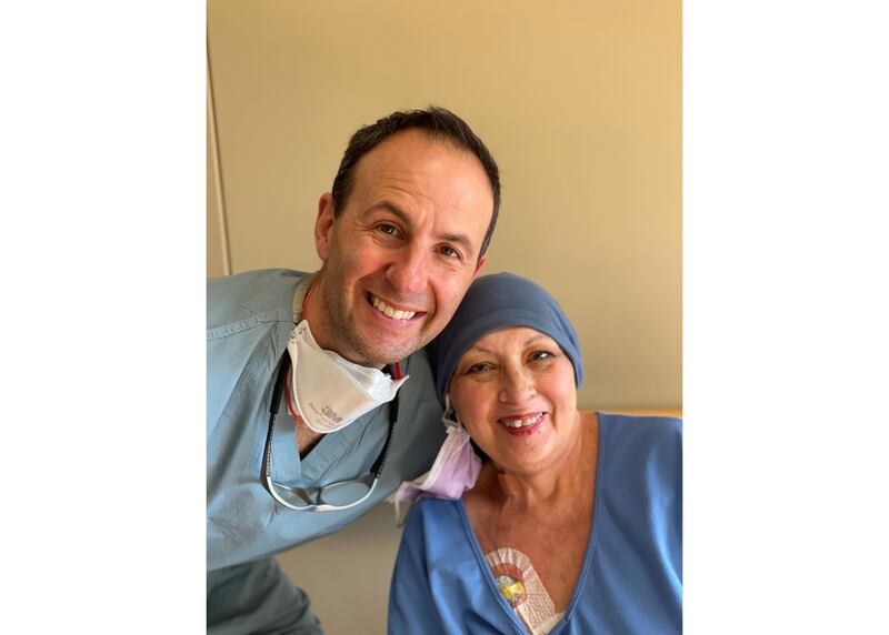 Dr. Joshua Tepper, an interventional radiologist at AMITA Health Saint Joseph Medical Center in Joliet, is pictured with his patient, KLinda Bland, 69, of Wilmington. Bland, a cancer patient, wound up in St. Joe's emergency department with a aortoesophageal fistula, a deadly medical emergency. Tepper saved her life with a procedure he had not previously performed.