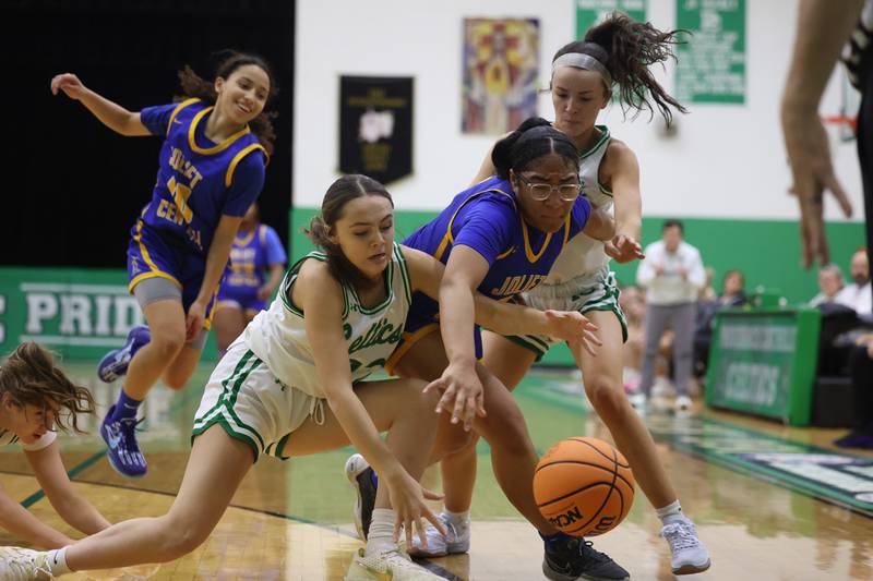 A host of Providence and Joliet Central battle for the loose ball in the WJOL Girls Basketball Tournament on Wednesday, Nov. 20, 2024 in New Lenox.