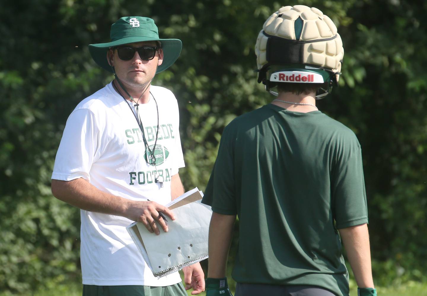 St. Bede head football coach Jack Brady watches his team run drills during the first day of football practice on Monday, Aug. 11, 2025 at St. Bede Academy.