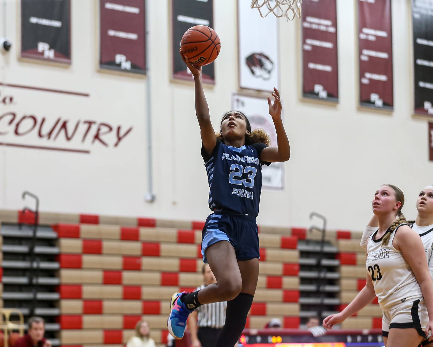 Plainfield South's Demi Page (23) puts in a lay up during basketball game between Plainfield South at Plainfield North. Jan 4, 2024.