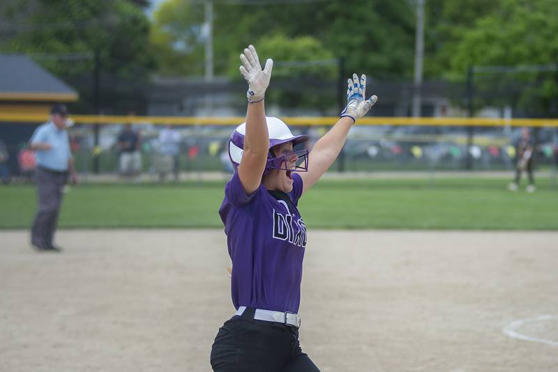 Dixon’s Sam Tourtillott celebrates teammate Izzy McCommons game tying home run Saturday, May 28, 2022 against Sterling.