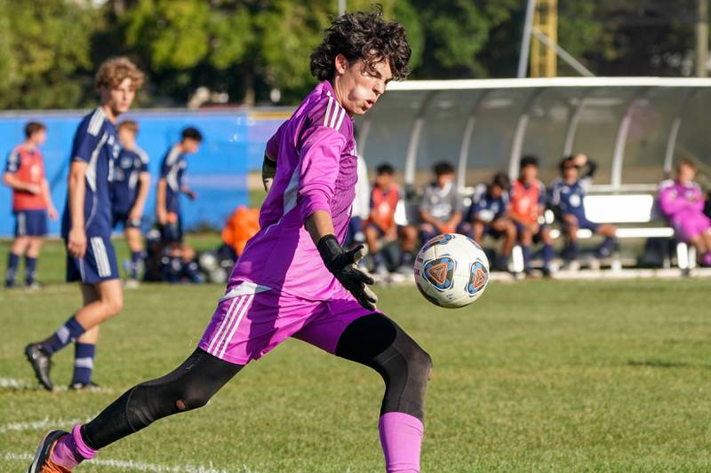 Oswego East's Carter Lucas (1) plays the ball on a goal kick against Oswego during a Southwest Prairie Conference game at Oswego East High School on Thursday, Sept. 25, 2025.