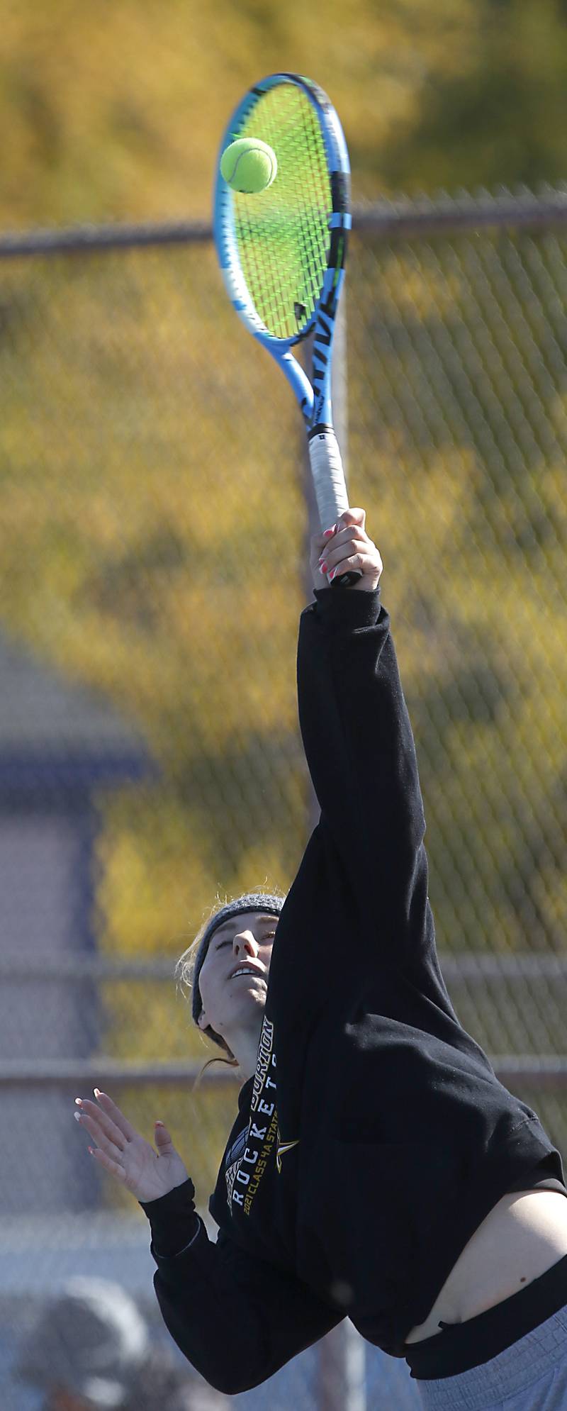 Richmond-Burton’s Savannah Webb serves the ball Thursday, Oct. 20, 2022, during during the first day of the IHSA State Girls Tennis Tournament at Hoffman Estates High School in Hoffman Estates.