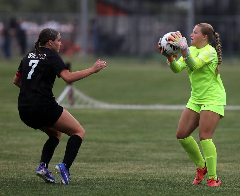 Crystal Lake South's Madelyn Smith grabs the bak as Prairie Ridge's Ava Gertz closes in during a Class 2A Crystal Lake Central Regional girls soccer semifinal match on Tuesday, May 19, 2026, at Crystal Lake Central High School.