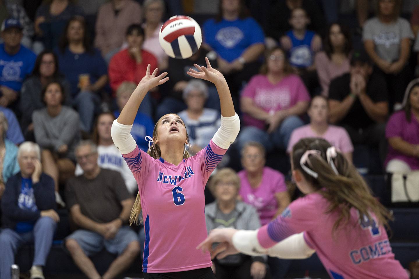 Newman’s Brooklyn Smith sets the ball against Erie-Prophetstown Tuesday, Oct. 14, 2025.