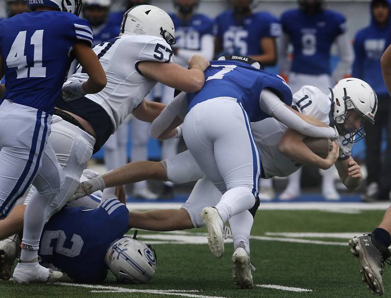 Cary-Grove's Peyton Seaburg is tackled by Geneva's Sean Lane during an IHSA Class 6A semifinal football game on Saturday, Nov. 23, 2024, at Geneva High School.