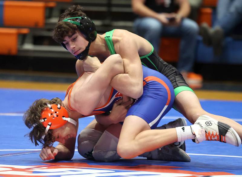 Rock Falls’ Josiah Tarbill tries to turn Genoa-Kingston's Jacob Rutkowski Thursday, Jan. 16, 2025, during their 126 pound match at Genoa-Kingston High School.