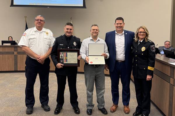 Morris police officer and civilian honored for saving a life on the Illinois River in August