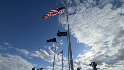 Raynor ceremoniously raises giant American flag above Dixon facility 
