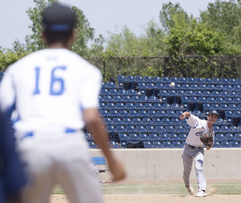 Newman’s Kyle Wolfe throws to first for an out against Chicago Hope Monday, May 29, 2023.