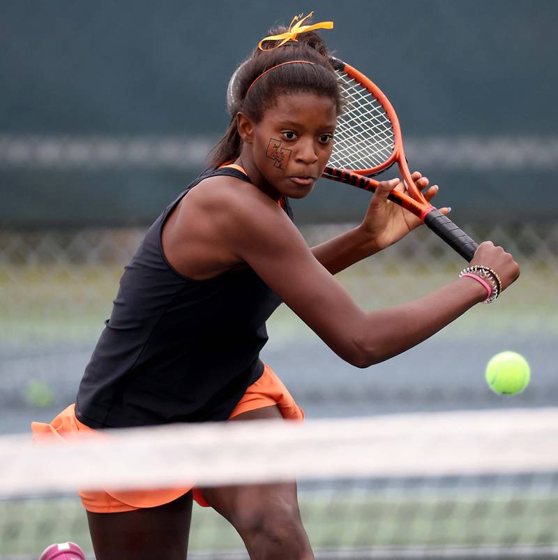 Elgin AcademyÕs Addison Lanton returns a shot in the 1A Singles Final match at the IHSA State Tennis Finals Saturday October 21, 2023 in Buffalo Grove.