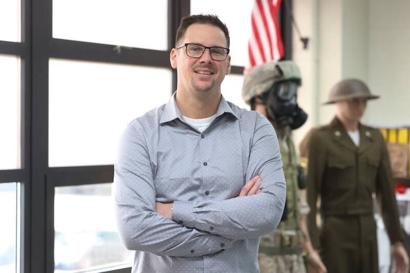 Morris High School History teacher Dylan Hamel, who served in the Navy and is a Navy Reservist, poses for a photo in his classroom on Monday, Oct. 16, 2023 in Morris.