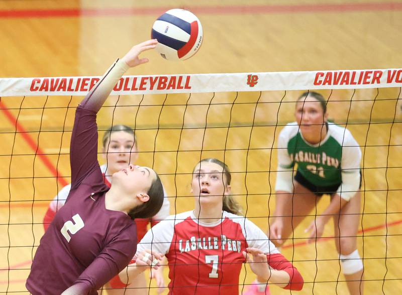 Morris's Cami Pfeifer hits the ball toward L-P's Aubrey Duttlinger during the Class 3A Sectional semifinal game on Tuesday, Nov. 4, 2025 in Sellett Gymnasium at L-P High School.