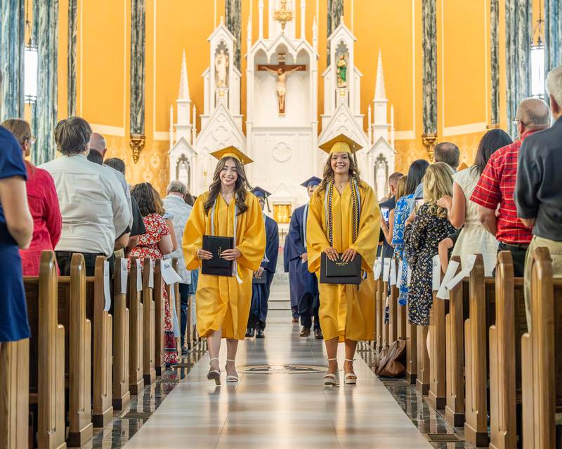 2026 Marquette Academy Graduate's Serenity Guzman and Ava Offermann lead class down isle after the commencement of the Class of 2026 Graduation Ceremony on May 24, 2026 at St. Columba Church in Ottawa.