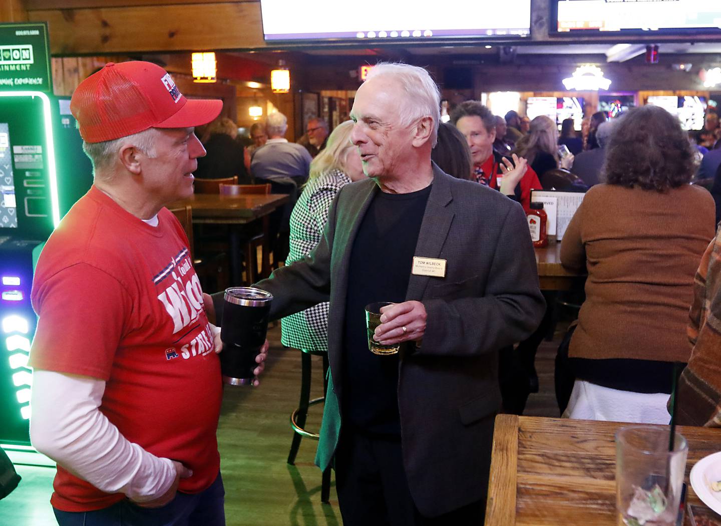 Illinois State Sen. Craig Wilcox, left, talks with Tom Wilbeck, a McHenry County Board member from District 1, during a Republican election night watch party Tuesday, Nov. 8, 2022, at Niko's Red Mill Tavern, 1040 Lake Ave. in Woodstock. The event was hosted by Wilcox, McHenry County Board Chairman Mike Buehler, McHenry County Coroner Michael Rein, and McHenry County Clerk Joe Tirio.