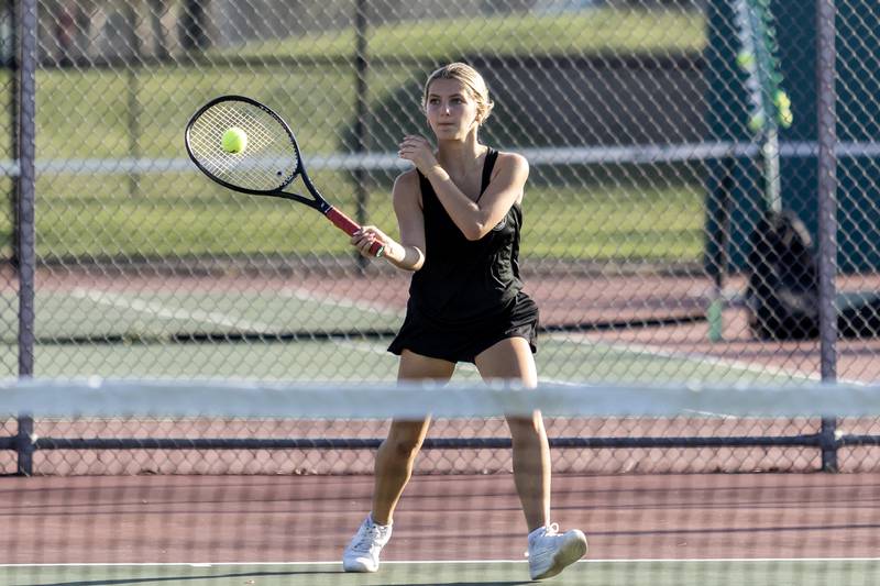 Joliet Township’s Mia Kristensen competes in varsity singles tennis during a match against Joliet Catholic at Joliet West on Sept. 29, 2025.