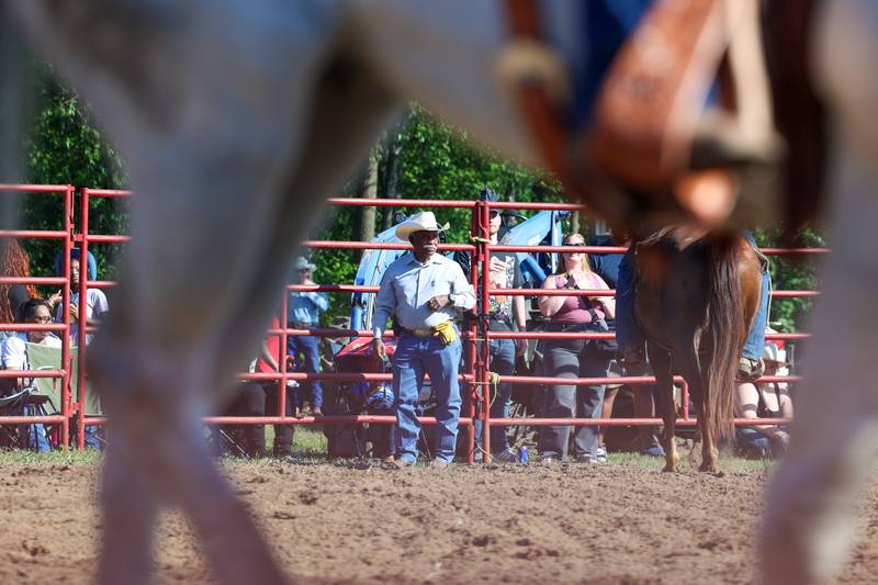 Mike Latting, owner of Latting Rodeo Productions, helps out inside the arena during the 50th Pembroke Rodeo on Sunday, May 24, 2026.