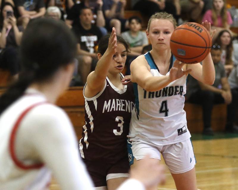Marengo’s Keatyn Velasquezn guards Woodstock North's Caylin Stevens as she passes the ball during the girl’s game of McHenry County Area All-Star Basketball Extravaganza on Sunday, April 14, 2024, at Alden-Hebron’s Tigard Gymnasium in Hebron.