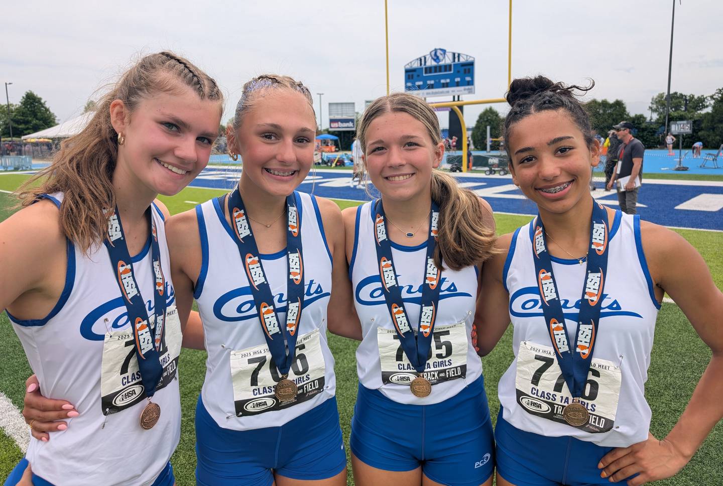 Newman Catholic's 4x100 relay members (from left) Lauren McClain, Ella Ford, Elena Allen and Paizlee Williams pose for picture with their Class 1A ninth-place medals during the IHSA Girls Track and Field State Meet on Saturday, May 24, 2025, in Charleston.